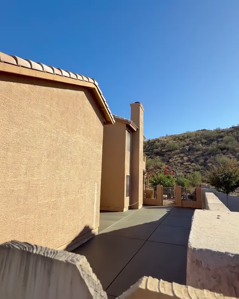Stucco-finished block wall alongside a Phoenix home
